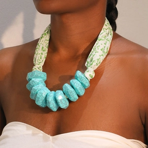 Bohemian style necklace with large turquoise resin beads and green heart print fabric