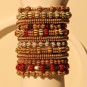 Bohemian multilayered pumpkin bead bracelet set with orange and gold accent beads