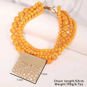 Detail of multi-layer orange beaded necklace with hammered gold square pendant dimensions