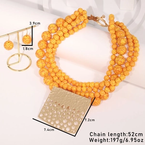Detail of layered amber bead necklace with gold square pendant and size dimensions