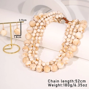 Detail of marble pattern beaded necklace set showing 52cm length and 180g weight specs