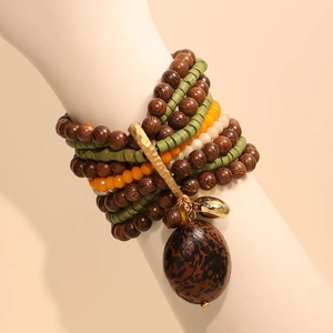 Bohemian multi-layer handmade beaded bracelet with dark wood beads and nut pendant