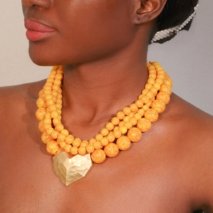 Bohemian multi-layer yellow marbled beaded necklace with a gold 3D heart pendant