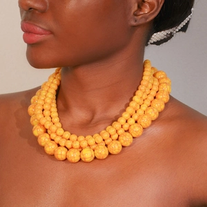 Multilayer yellow beaded necklace with red marble texture and heart pendant for women