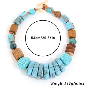 Detail view of woven turquoise and wood bead necklace with gold OT toggle clasp