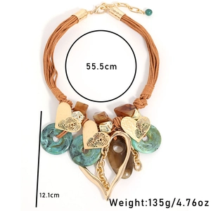 Bohemian woven cord necklace featuring oversized heart pendant and resin beads details