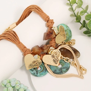 Bohemian multi-layer necklace with large gold heart pendants and turquoise resin rings