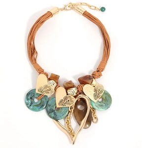 Bohemian woven cord necklace with large gold heart pendant and turquoise resin accents