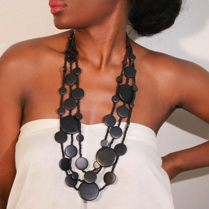 Handmade multilayer black beaded necklace featuring natural wooden discs for a boho look