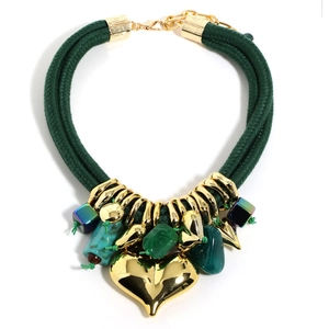 Detail of dark green woven rope necklace with gold heart pendant and gemstone charms