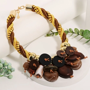 Bohemian style necklace with button pendants and mixed wood stone beads on woven rope