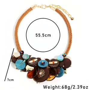 Bohemian handmade necklace with brown cord, acrylic discs and blue bead accents