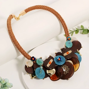 Handmade Bohemian necklace with brown woven rope, acrylic discs and amber accents