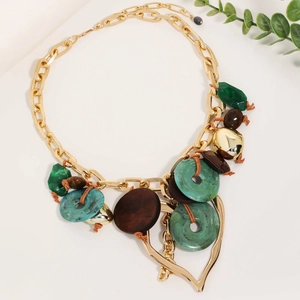 Bohemian chunky gold chain necklace with green resin rings and large hollow heart pendant