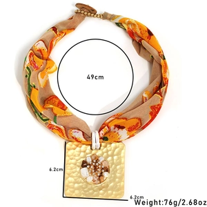 Detail view of square leopard print pendant with measurement specs for size and weight