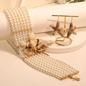 Multi-layer pearl beach jewelry set featuring starfish charms and matching earrings