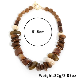 Detail of beaded necklace with wood beads, acrylic stones, and toggle clasp, 51.5cm length
