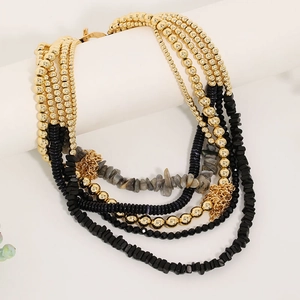 Bohemian multi-layer beaded necklace with gold accents and natural grey stone tassels
