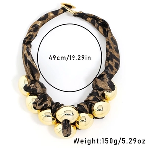 Detailed view of leopard print fabric necklace with chunky gold beads and size parameters