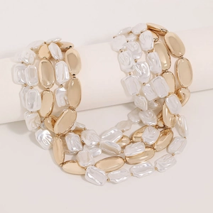 Elegant multi-layered necklace with golden metal beads and baroque style faux pearls