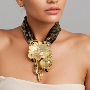 Golden leaf pendant necklace with metallic tassels and leopard print fabric strap