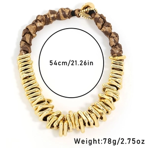 Gold chunky necklace with leopard print fabric links and irregular metal texture