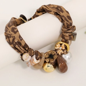 Leopard print fabric necklace with gold metal flowers and faux pearl pendant accents