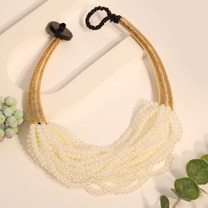 Multilayer white pearl necklace with golden spiral accents and vintage choker design