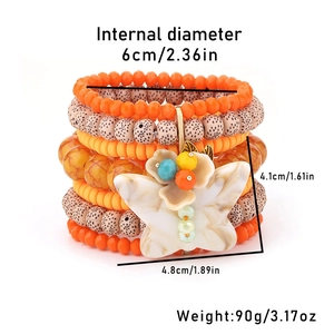 Detailed view of multilayer beaded bracelet set with white butterfly pendant and measurements