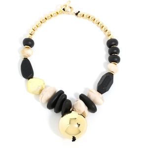 Close-up of retro chunky necklace with mixed wood, gold beads and cream faux pearl pendant