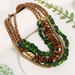 Layered bohemian necklace with green brown wood beads and gold statement charms