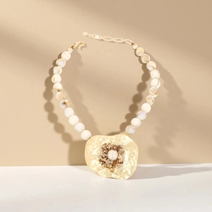 Bohemian white marble beaded necklace with gold hammered pendant and inset stones