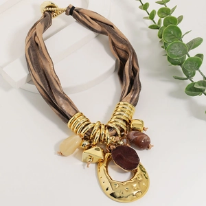 Bohemian silk rope necklace with gold textured hammer metal and dark stone pendant