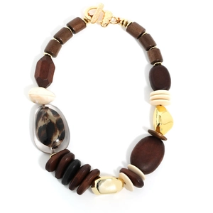 Detailed view of handmade beaded necklace with leopard print wood beads and toggle clasp
