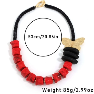 Detail view of red and black beaded necklace with butterfly pendant, 53cm and 85g specs