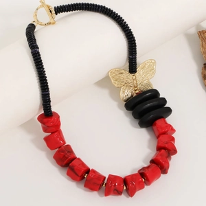 Bohemian chunky beaded necklace with red and black stones and gold butterfly charm