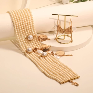 Elegant multi-layer pearl jewelry set with wide bracelet and baroque style drop earrings