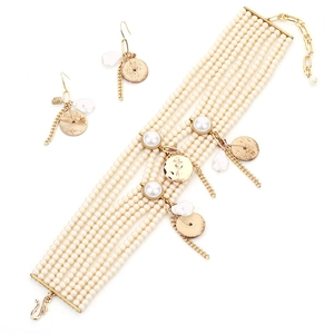 Elegant multi-layer pearl tassel necklace and earring set in bohemian gold finish