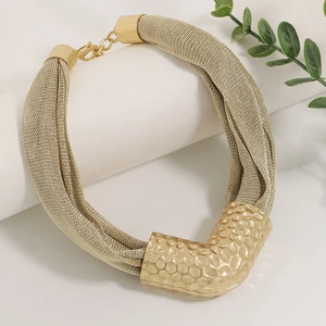 Golden multi-strand mesh chain necklace with hammered V-shape tube pendant on white stand