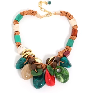 Detail of bohemian woven rope necklace featuring colorful stone pendants and resin beads