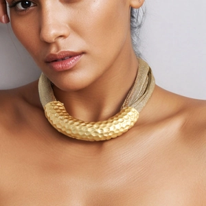 Statement gold multi-strand mesh chain necklace featuring a hammered U-shaped tube pendant