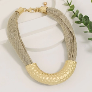 Golden mesh chain necklace with a U-shaped hammered metal tube in a luxury fashion design