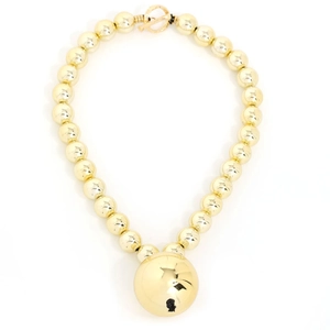 Elegant gold beaded necklace with a large spherical pendant and stylish OT clasp closure