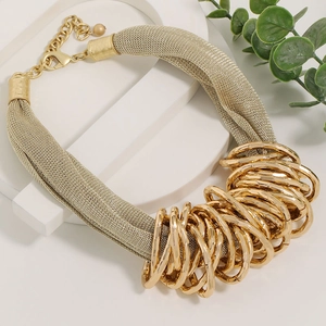 Luxurious gold woven mesh choker necklace with bold interlocking rings and layered design
