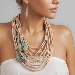 Multi-layer pink beaded necklace set with marbled blue circular charms and earrings
