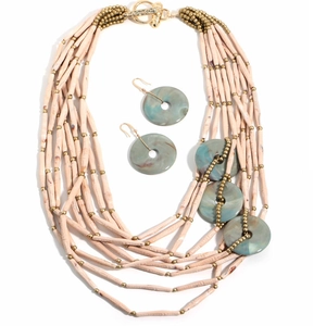 Detail of bohemian layered beaded necklace with turquoise-textured resin disks and earrings