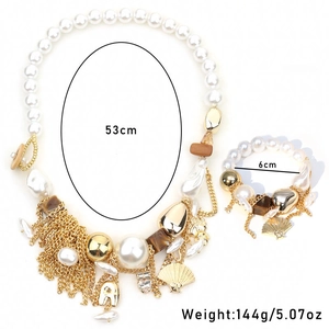 Detail view of Bohemian pearl and shell jewelry set with tassel chains and dimensions