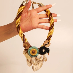Bohemian gold rope necklace with diverse round discs and natural seashells accessory