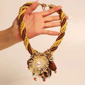 Vintage gold rope knot necklace set with leopard print stones and pearl accents