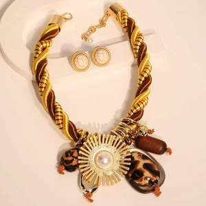 Bohemian gold rope necklace set with pearl pendants and leopard print accents